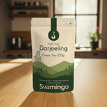 Darjeeling green tea package from svamingo on a wooden surface with a kitchen background