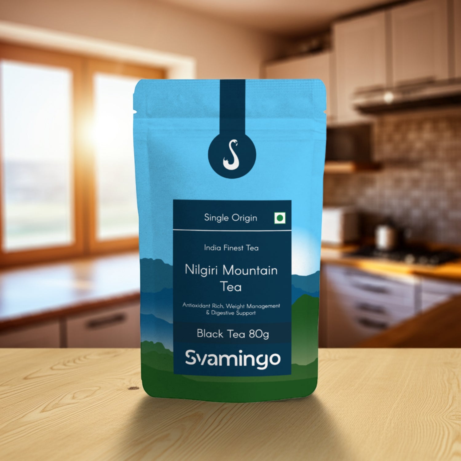 nilgiri black tea pouch from svamingo on a kitchen counter table with kitchen shelves in the background